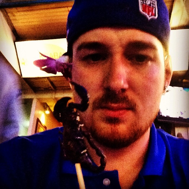 Eating a scorpion Eating a scorpion