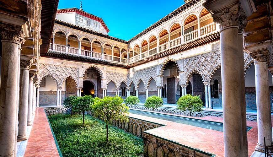 Alcazar Palace courtyard with garden in Seville Spain Europe - a setting for a game of thrones location