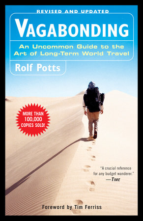 Front cover image of the book Vagabonding. One man walking in a desert over sand dunes with a backpack