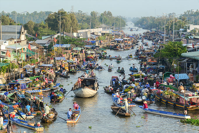 villagers selling their produce at a floating market 