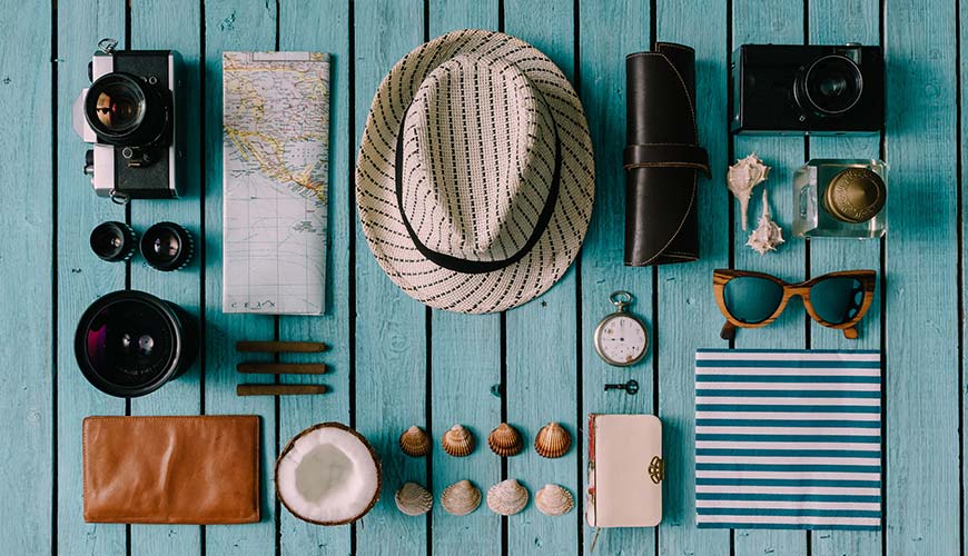 items for vacation neatly placed next to each other by organised traveller