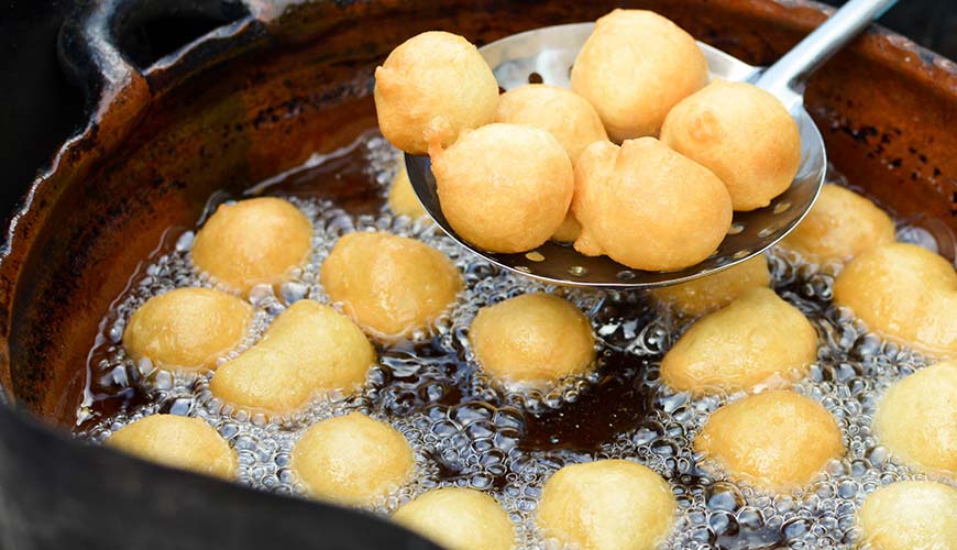 sweet deep fried bunuelos known as donuts at a local food market in guatemala