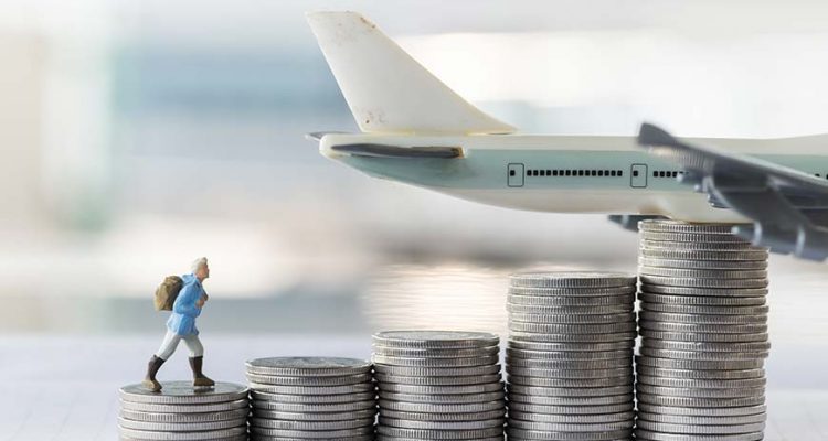 model plane with coins stacked in front of it
