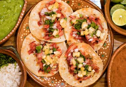 Tacos al pastor are a traditional cuisine found all over mexico a food which we recommend tasting whilst on holiday
