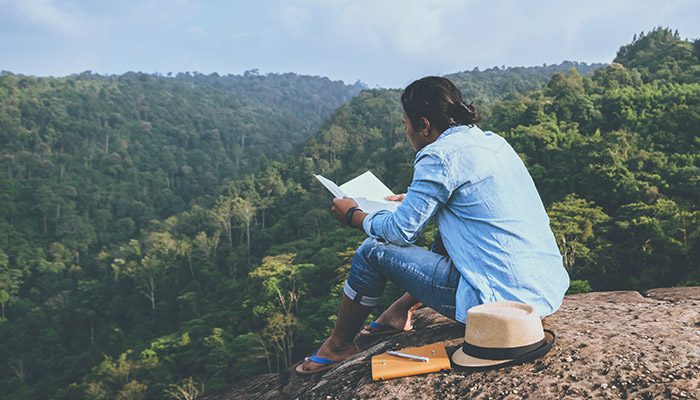 Man reading book in Thailand