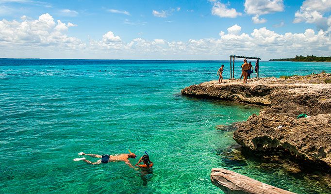 Travellers swimming in the Bay of Pigs in Cuba