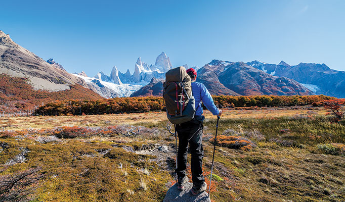traveller hiking in Patagonia with clear blue skies