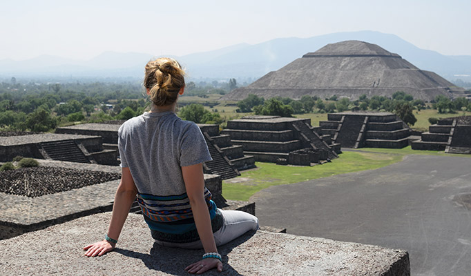 Girl enjoying the view over one of the best UNESCO World Heritage Sites, mysterious Teotihuacan in Mexico