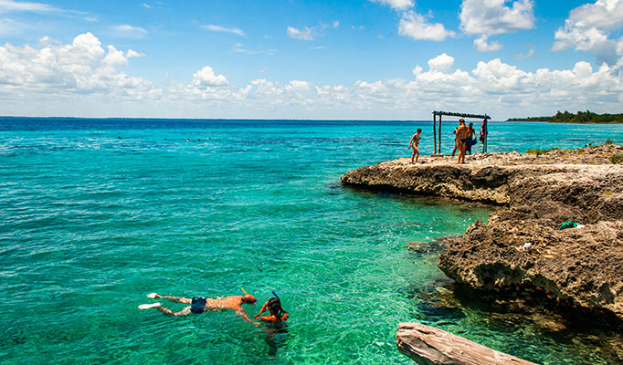 Travellers swimming in the Bay of Pigs in Cuba