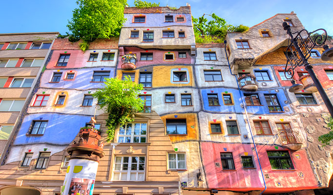 The colourful Hundertwasser Haus in Vienna, Austria, one of the best places to go in May