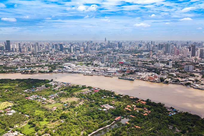 An image of part of the Green Lung park in Bangkok with the city skyline in the background