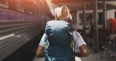 Image of a backpacker in a train station