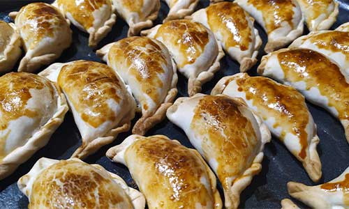Empanadas in Buenos Aires an image of empanadas at a street food stall in Buenos Aires