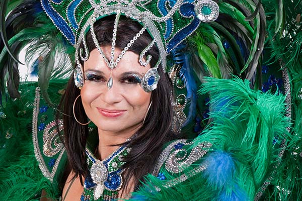 brazilian woman dressed in green and blue costume for rio carnival