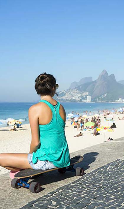 Rio de Janeiro, Brazil solo female traveller on rio beach looking out to sea and beach