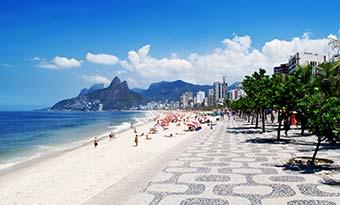 Discover Brazil on a group tour paradise beach with palm trees and white sand in Brazil