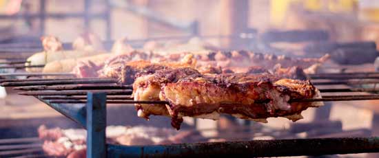 Churrasco chargrilled barbecue with Churrasco grilling over the fire
