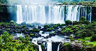Iguazu Falls travel on holiday to south america and be amazed as you visit the natural wonder of the world, iguazu falls which crosses from argentina into brazil