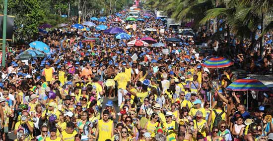 crowds of people flock to the streets of ipanema for the fun carnival festival party