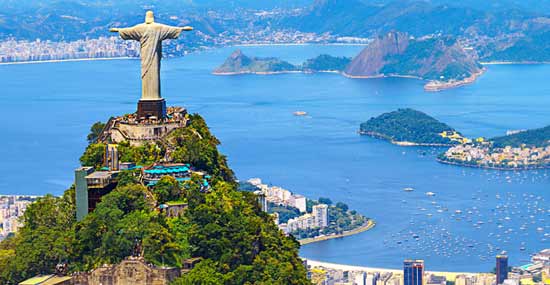 Christ the redeemer on top of Corcovado Mountain aerial view of corcovado mountain and christ the redeemer which is being visited by traveller after traveller as its one of the top tourist attractions of rio de janeiro
