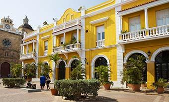 Best time to visit Cartagena, Colombia yellow painted buildings in cartagena colombia