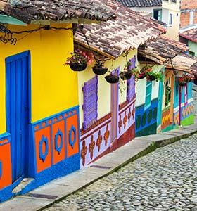 line of colourful painted houses in a traditional colombian town