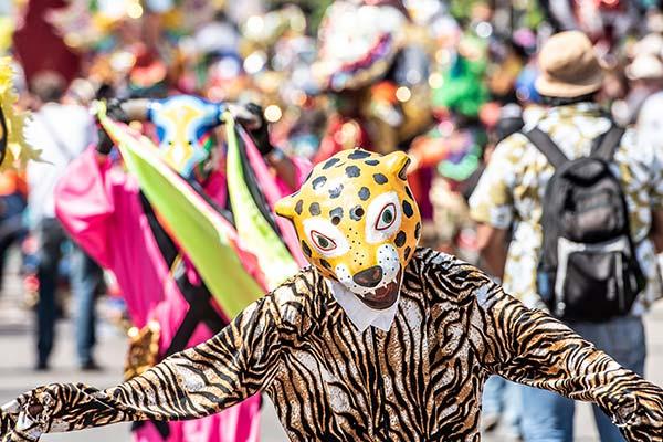 person wearing leopard costume for barranquilla carnival in Colombia