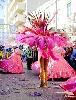 woman wearing huge pink costume for colombia street party san pacho festival