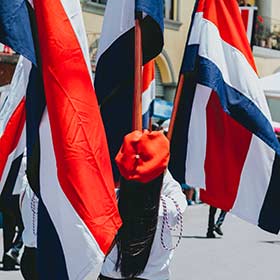 Independence Day in Costa Rica A woman carrying a flag in a procession on Independence Day in Costa Rica