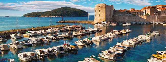 Image showing Dubrovnik harbour and a row of boats