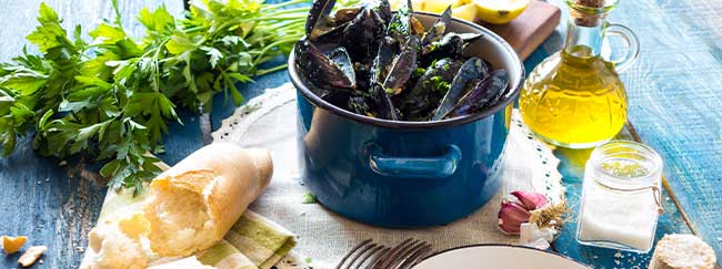 Travel to Croatia and enjoy fresh, local produce such as mussels as shown in this image
