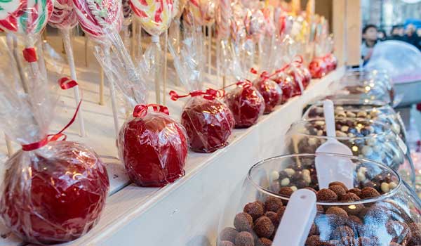 Zagreb Christmas market stall candy apples on display at a Christmas market in Zagreb, Croatia