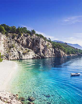 Take in the beauty of the Adriatic Ocean on a tour of Croatia A view of the coastline in Croatia with the blue Adriatic Ocean