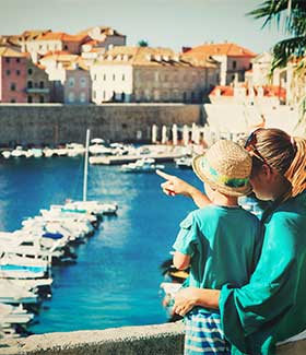 A mother and son look out over Dubrovnik a mother and son look out over Dunrovnik