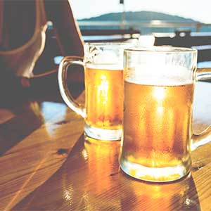 two full glasses of beer being enjoyed by travellers in Croatia
