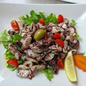 a plate of octopus salad