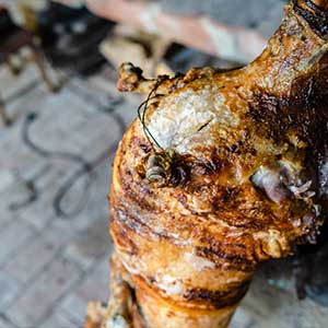 a spit-roasted lamb ready to be eaten