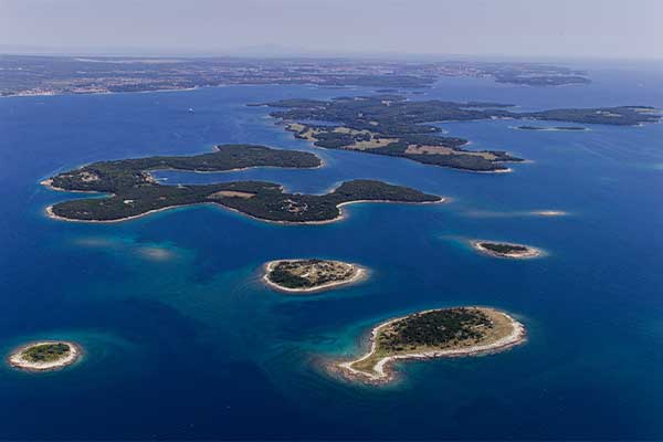 a birds eye view of the islands in Brijuni national park in croatia surrounded by the adriatic sea