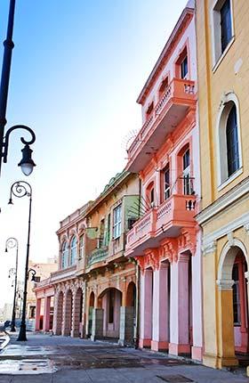 Old Havana, Cuba pastel coloured buildings on quiet street in old havana cuba