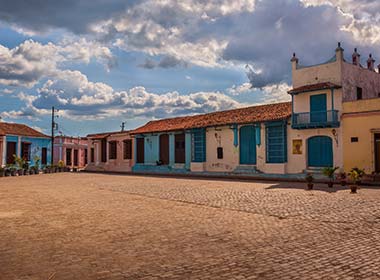 traditional houses in cobbled square of camaguey on a tour to cuba
