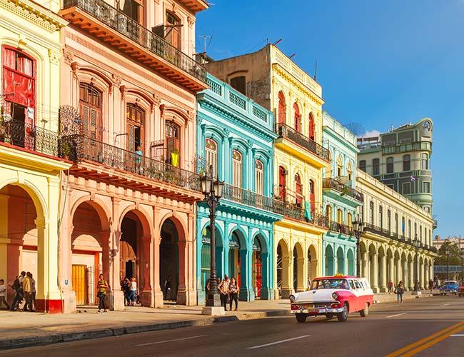 colourful buildings and classic cars in havana cuba
