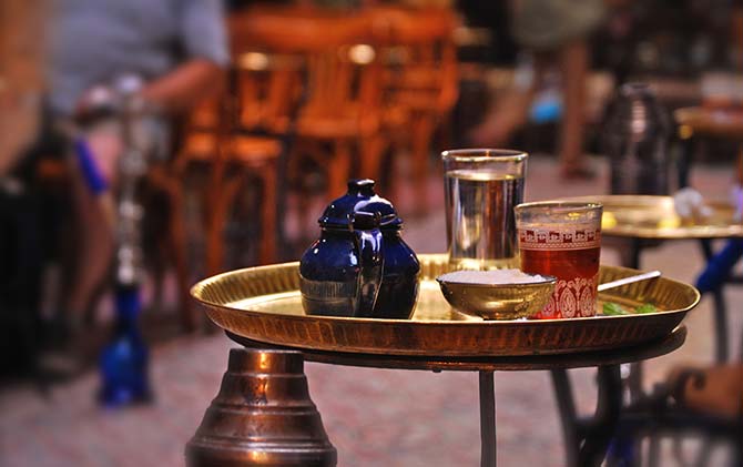 Traditional tea on Leylet en Nuktah egyptian tea served traditionally on a gold tray on the streets of egypt