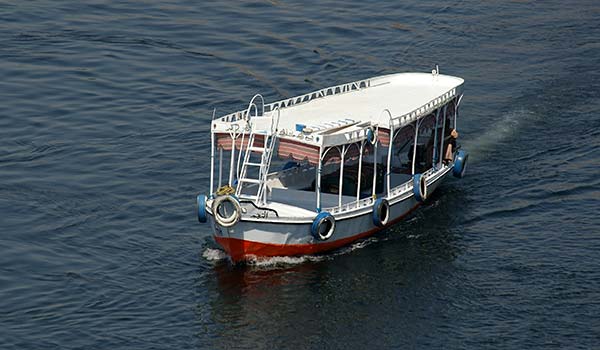 Travelling by water taxi in Egypt sailing down the river nile on a water taxi in egypt