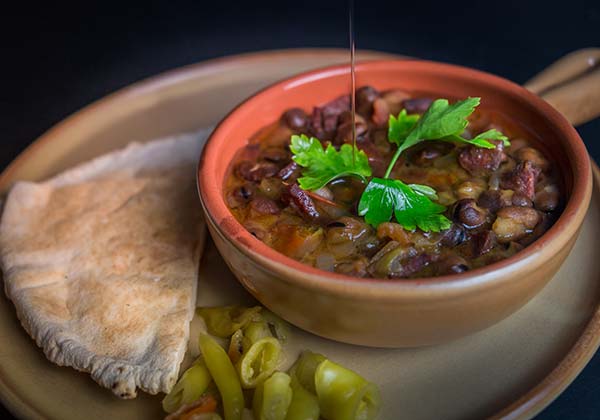 Ful Medames - popular Egyptian dish egyptian food dish of ful medames with pitta and chillies