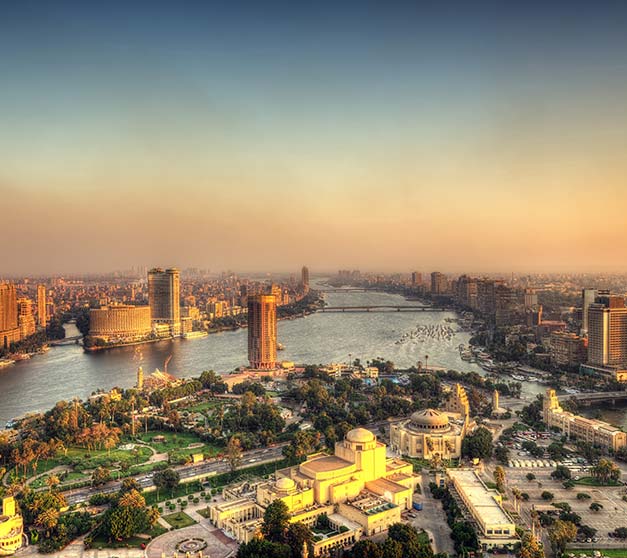 sunset over the skyline of cairo egypt with the river nile