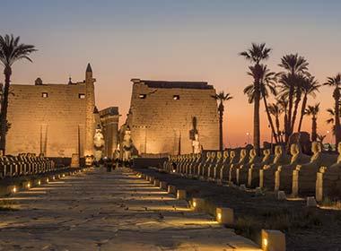 visit luxor in the evening to see the remains glowing at night in egypt