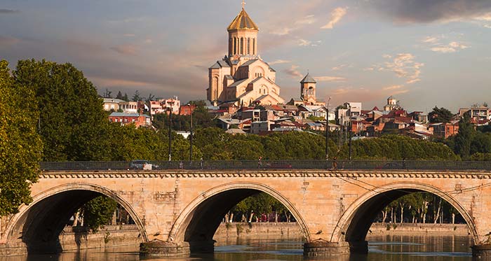 Saarbrucken Bridge, Tbilisi Georgia Saarbrucken Bridge and Sameba Cathedral in Tbilisi Georgia