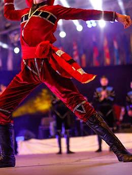 Art-gene festival in Georgia man in traditional georgian costume dancing on stage