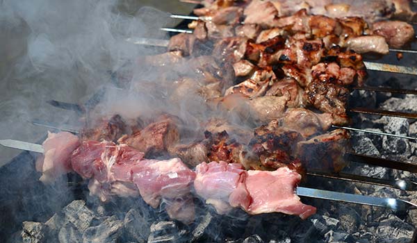 Mtsvadi georgian skewered meat on an open flame