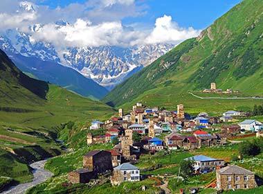 village in the steep green valleys of ushguli georgia mountains surrounding